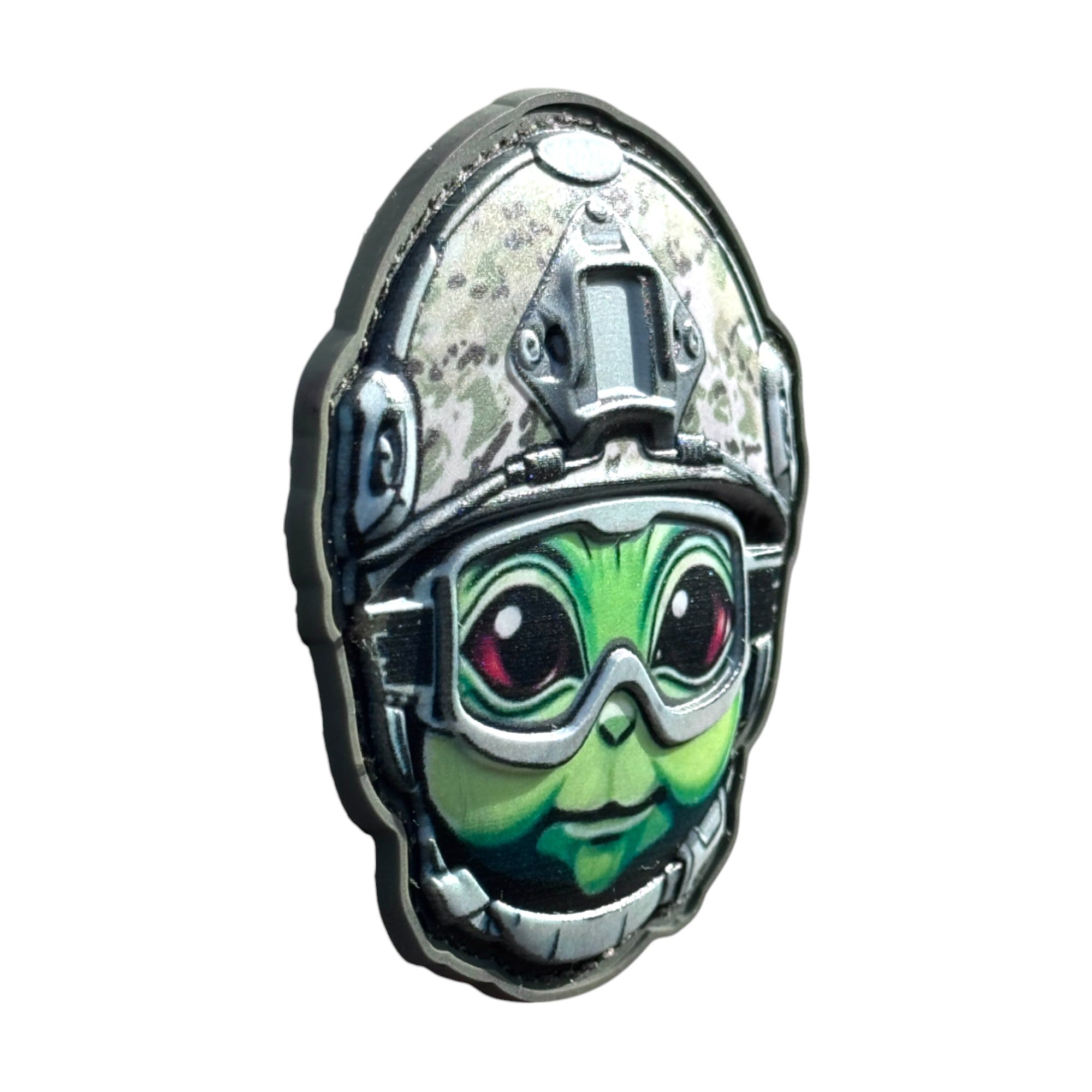 Green alien emoji wearing a combat helmet on a tactical military 3D PVC Hook and loop patch. Side view. Ideal for adding a unique and fun touch to your gear.