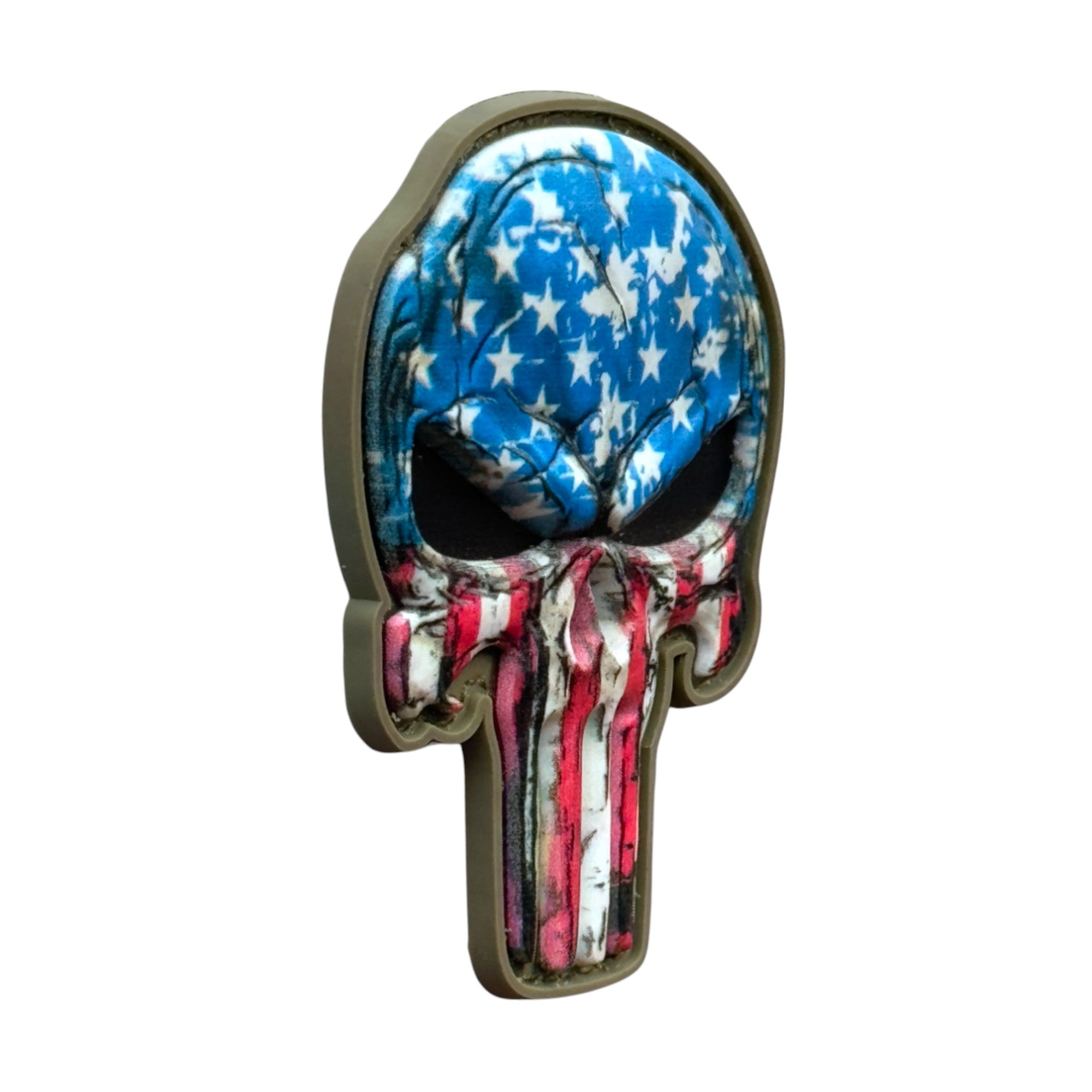 Punisher Skull with USA flag camo on a tactical military 3D PVC Hook and loop patch. Side view. Ideal for adding a unique and fun touch to your gear.