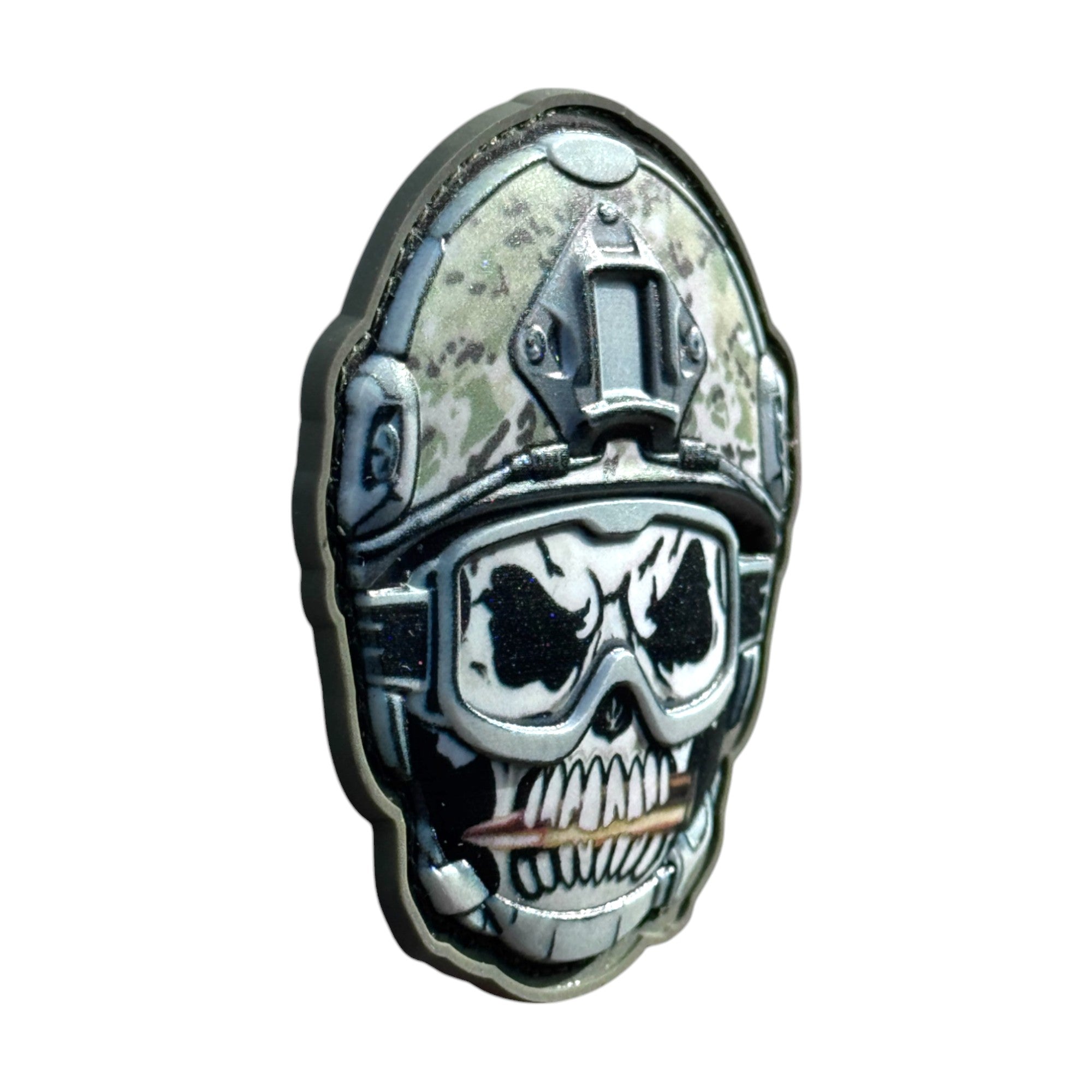 Skull with bullet in mouth emoji wearing a combat helmet on a tactical military 3D PVC Hook and loop patch. side view. Ideal for adding a unique and fun touch to your gear.