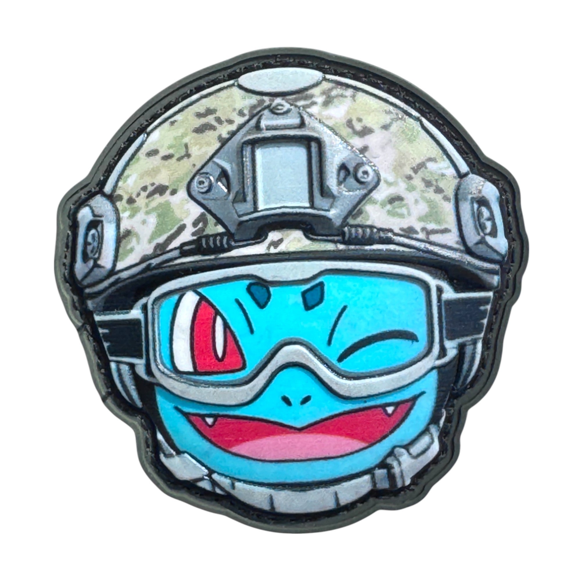 Sky blue winking emoji wearing a combat helmet on a tactical military 3D PVC Hook and loop patch. Ideal for adding a unique and fun touch to your gear.