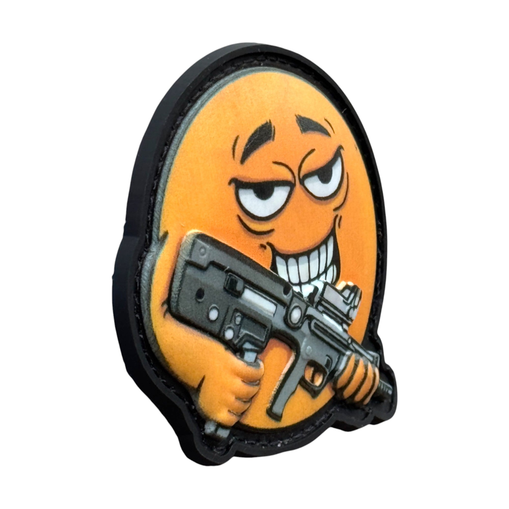 Smiling yellow emoji holding a rifle on a tactical military 3D PVC Hook and loop patch. Side view. Ideal for adding a unique and fun touch to your gear