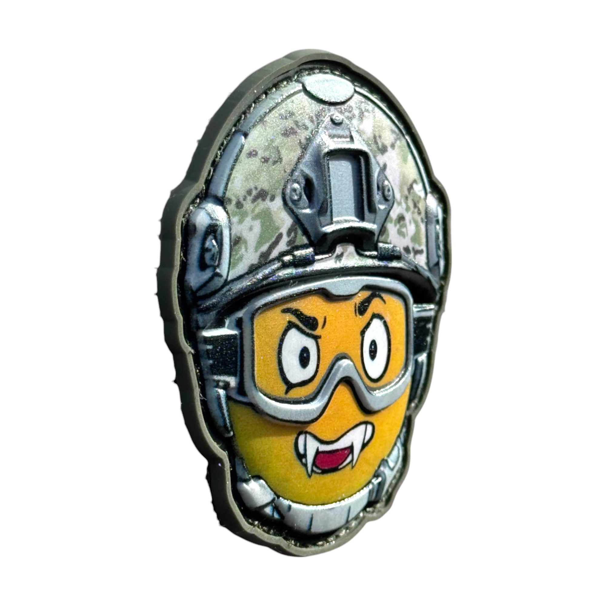 Yellow emoji with teeth, wearing a combat helmet on a tactical military 3D PVC Hook and loop patch. side view. Ideal for adding a unique and fun touch to your gear.