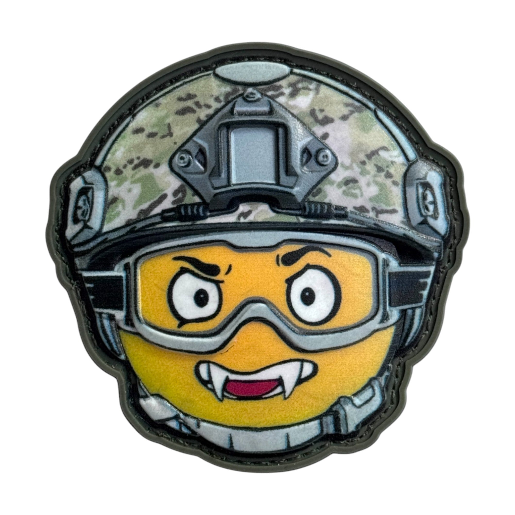 Yellow emoji with vampire fangs, wearing a combat helmet on a tactical military 3D PVC Hook and loop patch. Ideal for adding a unique and fun touch to your gear.