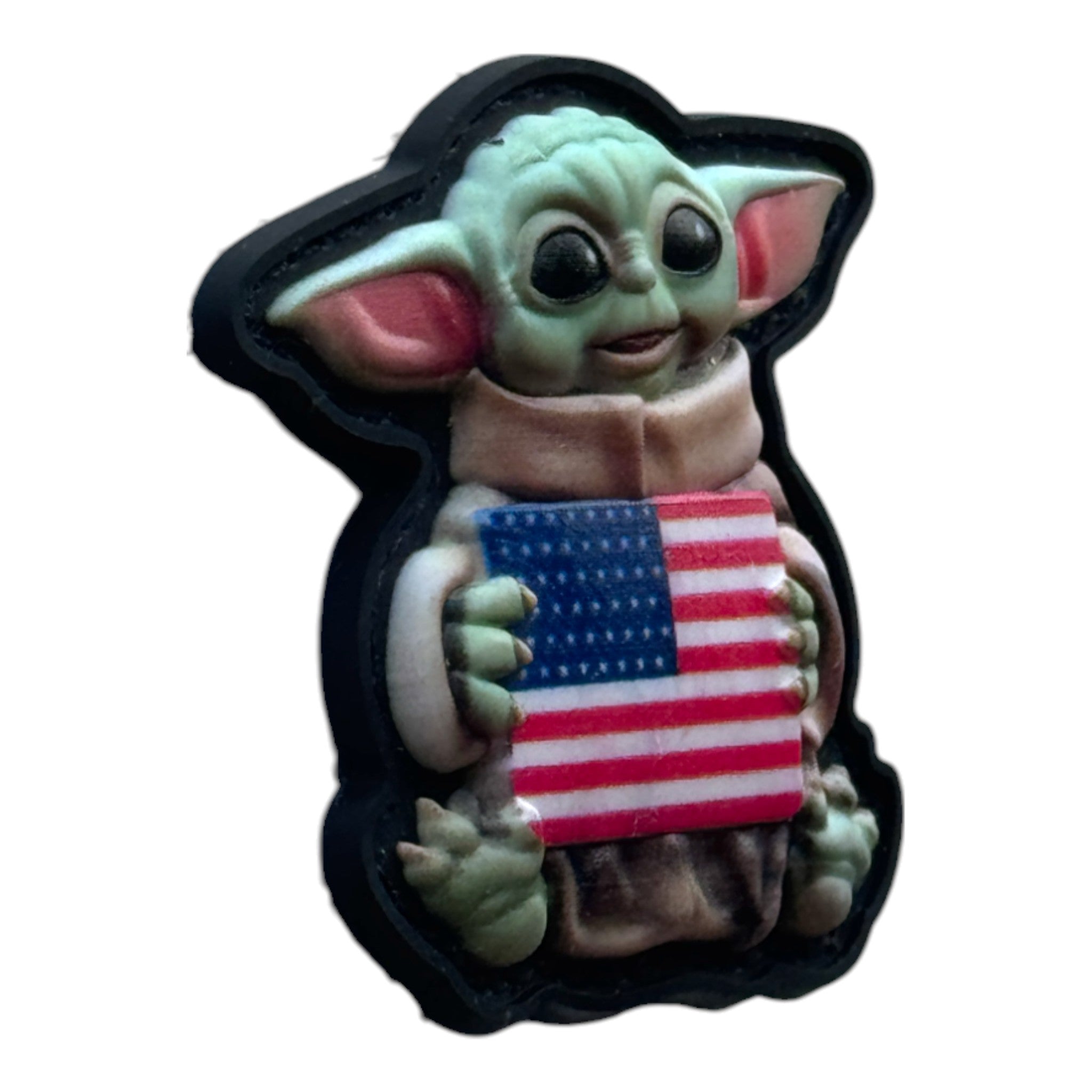 Baby Yoda holding USA flag on a tactical military 3D PVC Hook and Loop patch. Side view