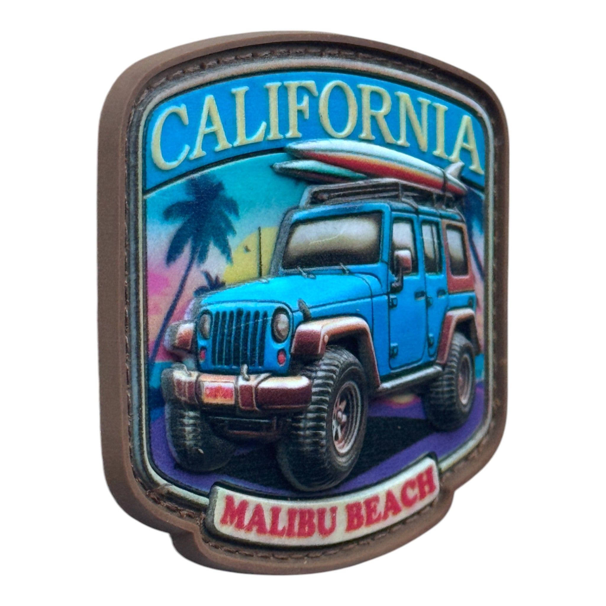 Blue jeep on a beach with the text 'California' and 'Malibu Beach.' 3D PVC Velcro patch with hook and loop backing. Side view