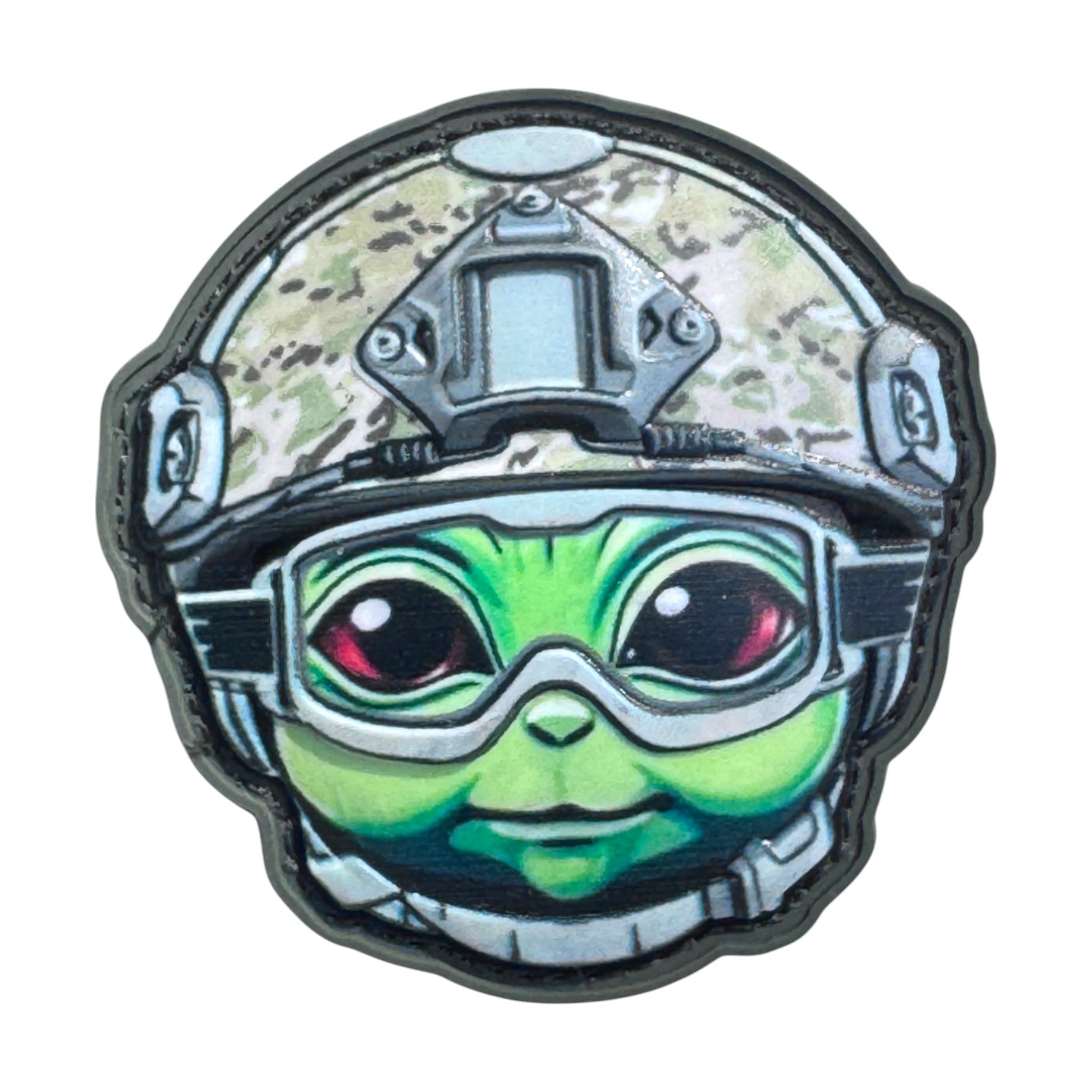 Green alien emoji wearing a combat helmet on a tactical military 3D PVC Hook and loop patch. Ideal for adding a unique and fun touch to your gear.