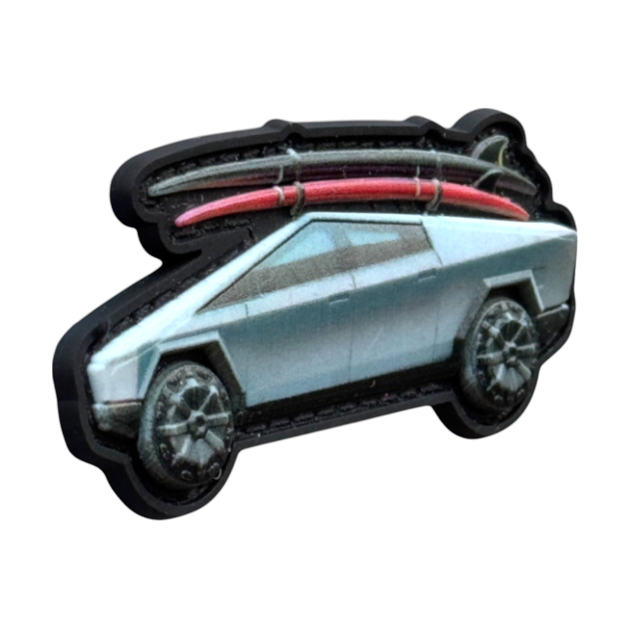 Silver Cybertruck with surfboards on top. 3D PVC Velcro patch with hook and loop backing. Side view