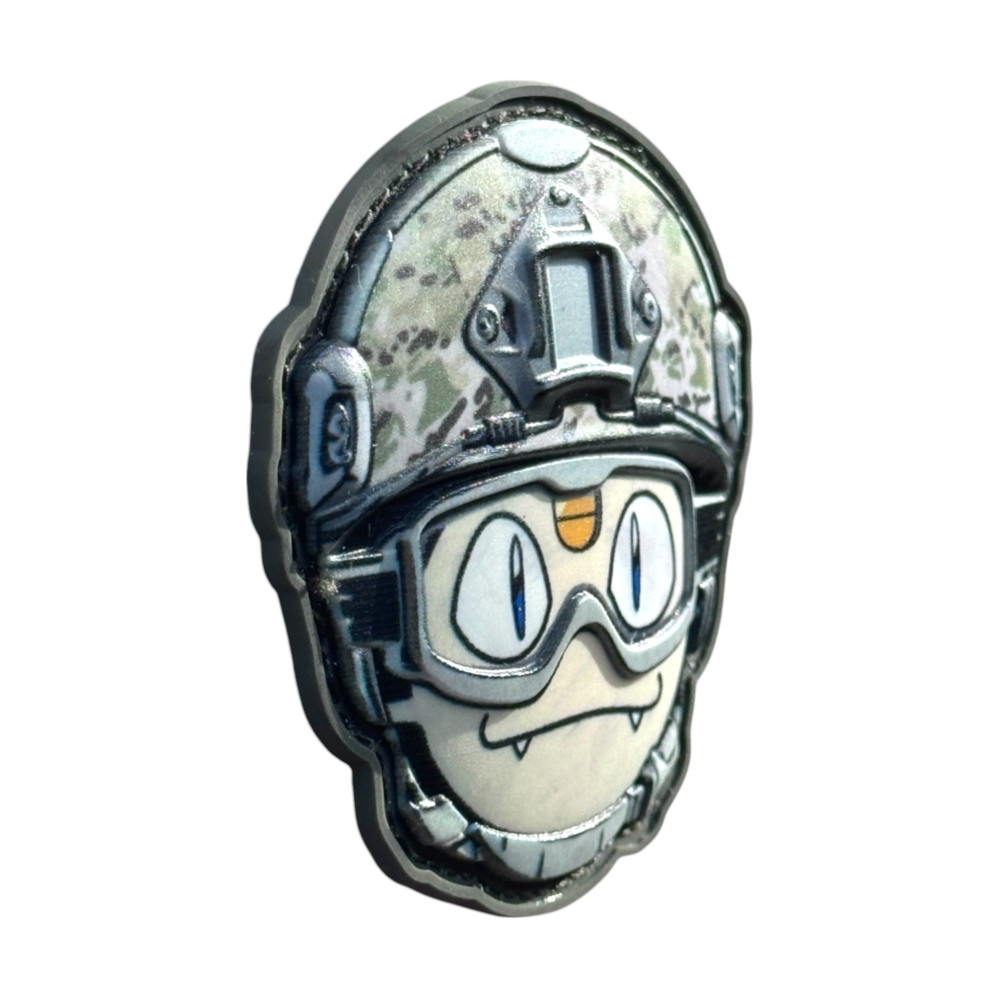 white face emoji with little teeth wearing a combat helmet on a tactical military 3D PVC Hook and loop patch. Side view. Ideal for adding a unique and fun touch to your gear.